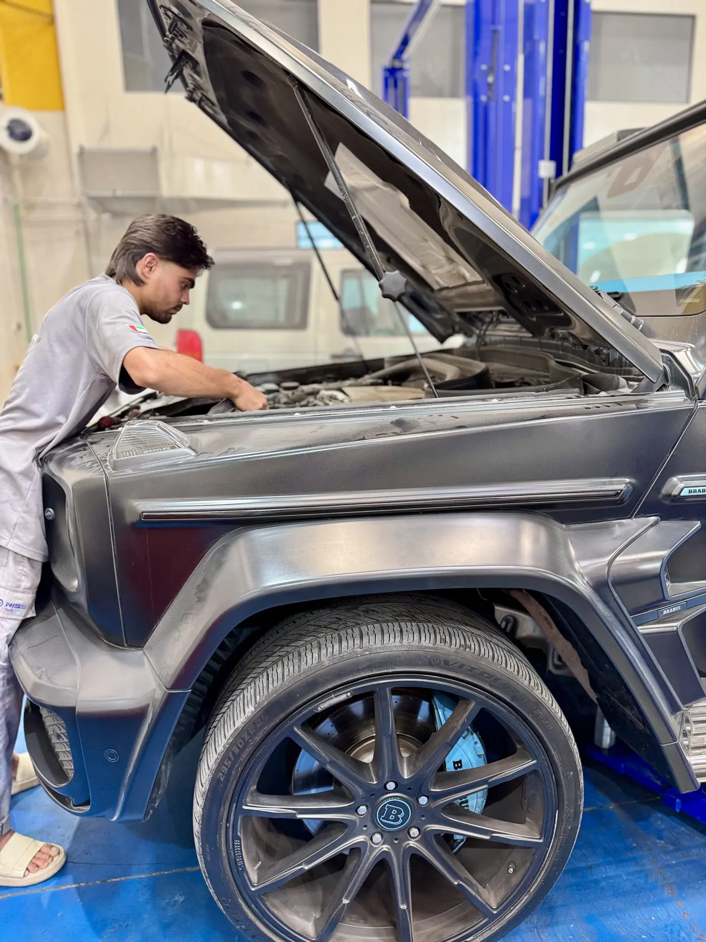 Car Inspection Dubai 47 Technician carrying out an engine bay inspection on a G-Wagon in Dubai
