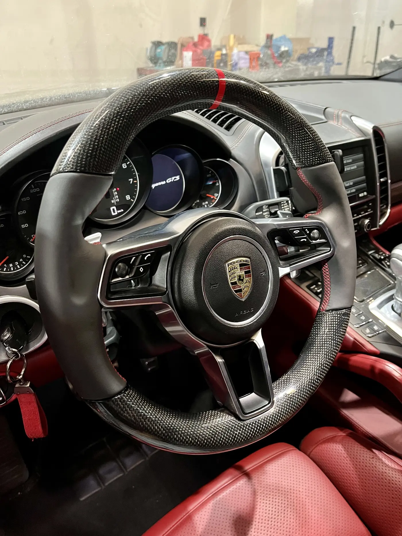 Porsche steering wheel and cockpit during modification work in Dubai