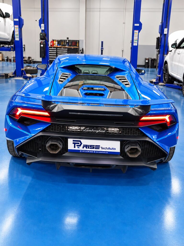 Lamborghini Repair & Service Dubai 49 Rear view of a blue Lamborghini Huracan in the Rise Tech Auto workshop in Dubai