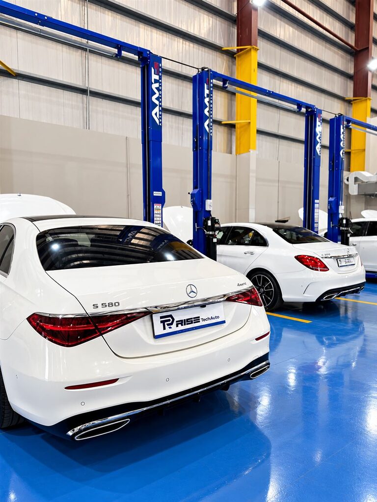 Mercedes-Benz S-Class in the service bay with car lifts at Rise Tech Auto in Dubai