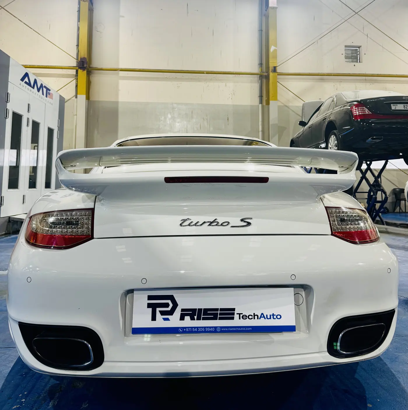 Porsche 911 Turbo S rear view in the Rise Tech Auto workshop